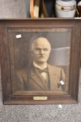 A large early 20th-century framed portrait photograph, with a commemorative plaque that reads 'W.