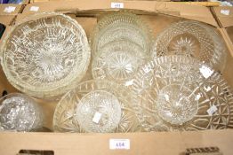 A collection of glass fruit bowls and a pressed glass desert set.