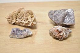 A collection of four assorted minerals, unknown age, including amethyst clusters and a desert rose