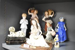 A miscellaneous selection of Capodimonte and similar style figures and figurines, largest