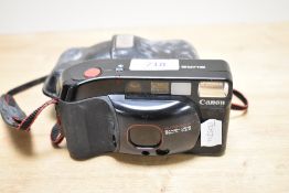 A Canon 35mm Sure Shot Supreme camera in soft cover