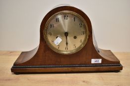 A Napoleon hat style wooden mantel clock.