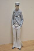 A Lladro porcelain figure, 'Sea Captain' model number 4621, measuring 37cm tall, damaged pipe from