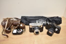Two cameras, a tripod and light meter. A Voigtlander Vito Automatic 1 with Lanther 2,8 50mm lens,