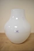 A large white glass vase of bulbous form 33cm x 26cm.