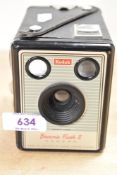 A vintage Kodak Brownie Flash II box camera in canvas carry case