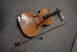 A traditional violin, having two piece 14 inch back, interior label Stradivarius 1797 (copy), sold