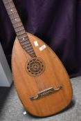 A traditional guitar style 6 string lute, having bowl back, overall length approx. 97cm