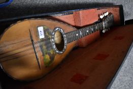 A traditional Neapolitan bowl back mandolin, partially labelled interior (napoli) , sold with case