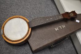 An early to mid 20th Century Keech banjo ukulele (Banjulele), serial number P2918, scratched