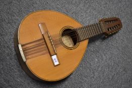 A traditional French flat back mandriola (12 string mandolin), internal label for Jaca