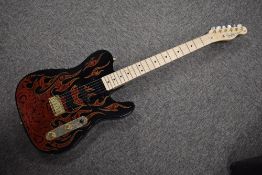 A USA made Fender Telecaster electric guitar, being James Burton signature paisley , imported in
