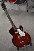A vintage Harmony Rocket hollow body electric guitar