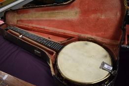 An early 20th Century John Grey & Sons, London Five String banjo having unusual Indian brass style