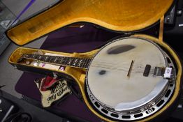 A vintage Antoria 'lawsuit' style five string banjo , in the Gibson Mastertone style, sold with