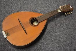 A traditional Spanish flat back pear shaped mandolin (8 string) , labelled internally Vicente