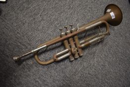 A traditional brass trumpet, marked skylark
