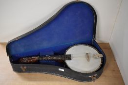 A Banjo Mandolin labelled 'the Broadcaster J&AM, London' made by John Grey and Sons for J & A