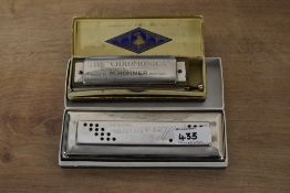 Two boxed Harmonicas. A M Hohner 'the Chromonica' and a Hero Harmonica