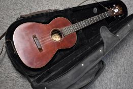 A Lyle ukulele , model U80, in padded Riptide case