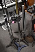 A selection of vintage mic stands having solid bases and telescopic action