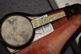 An early to mid 20th Century John Grey & Sons banjo ukulele , having pearlescent neck and metal