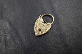 A 9ct gold heart padlock clasp, having decorative scroll engraving to the front, marked 375, 3.6g