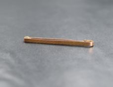 A 9ct gold bar brooch, having decorative engraving, marked 9ct, 1.7g