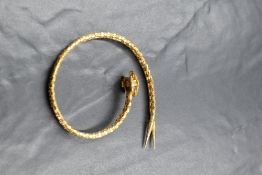 An 18ct gold bracelet, the two snake link chains bonded together with pointed articulated