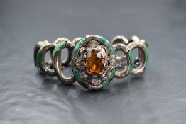 An early 20th century Scottish white metal (possibly silver) and malachite bracelet, having a