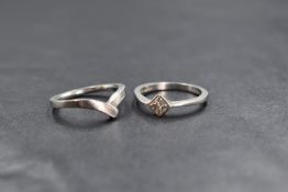 A platinum wedding set, comprising a diamond set solitaire and band, the princess cut diamond