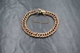 A 9ct rose gold curb link bracelet, having a box clasp, marked 375, 11.9g