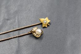 An 18ct gold diamond set leaf stick pin, the leaft motif having a central cushion old cut diamond,