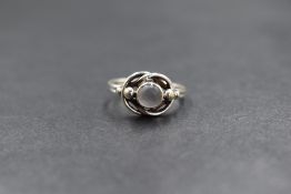 A Georg Jensen silver Arts and Crafts moonstone set ring, design 5, the central moonstone cabochon