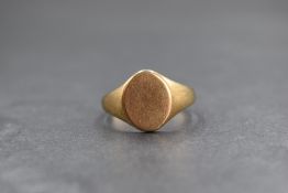 A gent's 9ct gold signet ring having an oval vacant shield, size W & 5.4g