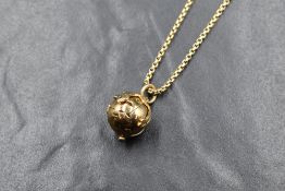 A 9ct gold Masonic expanding orb pendant, marked 375, on a 9ct gold chain, marked 375, 16.3g