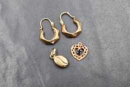 A pair of 9ct gold hoop earrings of moulded hexagonal form, a 9ct gold coffee bean pendant and a