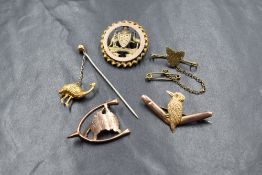 A group of five 9ct gold Australian brooches, comprising an Australia outline and wishbone, a