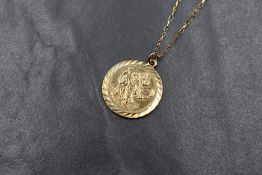 A 9ct gold St Christopher medallion pendant, marked 375, on a 9ct gold chain marked 9k, 3.1g