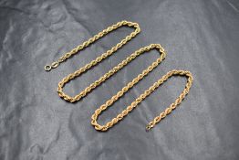 A 9ct gold rope link chain, approx 20' & 6.3g and a 9ct gold single hoop earring of large form,