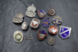 A selection of HM silver badges and clips including ARP, Lowther Old Girls Asscn, NUR, Blood Doning,