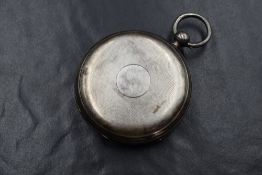 A Victorian silver hunter key wound pocket watch having a Roman numeral dial with subsidiary seconds