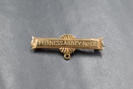 A 9ct gold medal bar brooch, having 'Furness Abbey No 102' engraved and personalised engraving to