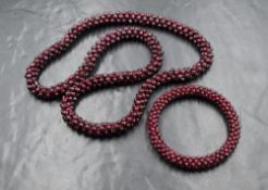 A torsade garnet bead necklace and small matching bangle