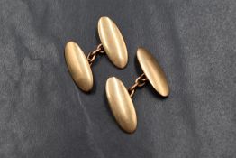 A pair of 15ct gold cufflinks, of long oval form having chain links, marked 15, 8.2g