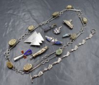 An assortment of silver and white metal jewellery, including various Egyptian motif pieces such as