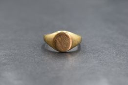 A 9ct gold signet ring, having an oval panel of plain form, marked 375, ring size N-O, 4.5g