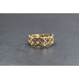 A 9ct gold Celtic knot motif ring, of pierced interlocking design, marked 375, ring size W, 2.9g