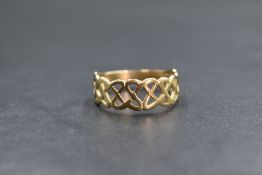 A 9ct gold Celtic knot motif ring, of pierced interlocking design, marked 375, ring size W, 2.9g