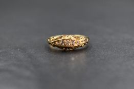 An 18ct gold diamond set five stone ring, the five graduated old cut diamonds, in a channel style